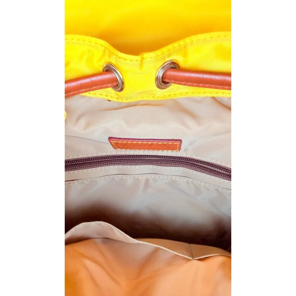 Dooney & Bourke Nylon Murphy Backpack Flap‎ Tassel Drawstring Womens Yellow